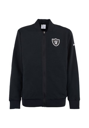Giacca nera con zip realizzata in tessuto liscio, con logo dei Raiders sul petto e colletto alto. Maniche e orlo a costine.
