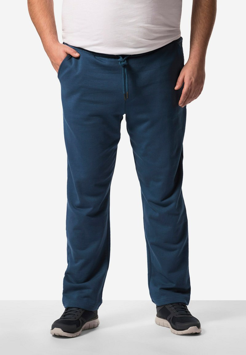 Navyblaue Sweatpants aus weichem Stoff, mit einem elastischen Bund, einer Kordel und seitlichen Taschen. Ideal für die Freizeit.