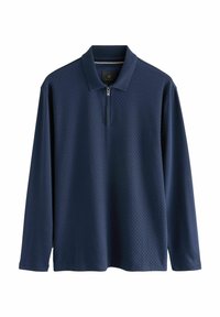 Polo shirt cu mânecă lungă de culoare bleumarin, cu un model texturat, cu fermoar la jumătate și guler clasic. Fabricat dintr-un material ușor.