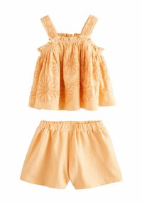 Orangenes Zweiteiler-Outfit mit einem ärmellosen Top mit floraler Stickerei und Shorts mit elastischem Bund. Strukturierter Stoff mit weicher Haptik.