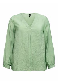 Haut vert clair à manches longues avec col en V et tissu texturé. Comprend des poignets plissés et une coupe décontractée. Convient pour une tenue décontractée.
