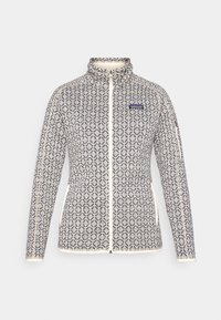 Dámská fleecová bunda s plným zipem, vzorovaná, s vyšším límcem, dvěma bočními kapsami a logem Patagonia na hrudi.