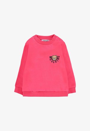 Sweatshirt rose à manches longues, avec des bords côtes aux poignets et au col. Porte un graphique d'ours sur la poitrine avec le nom de la marque en noir.