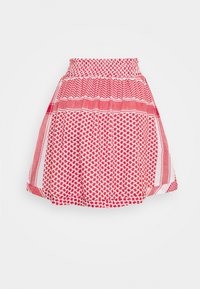 Jupe à motif rouge et blanc avec une taille smockée et des designs géométriques, présentée à plat sur un fond blanc.