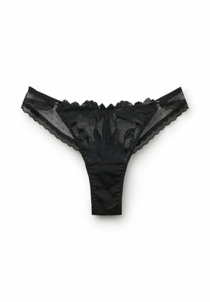 Zwarte kant string met bloemenpatronen, gegolfde randen en een stevige stof tailleband. Doorzichtige kanten zijkanten met stippenstructuur.