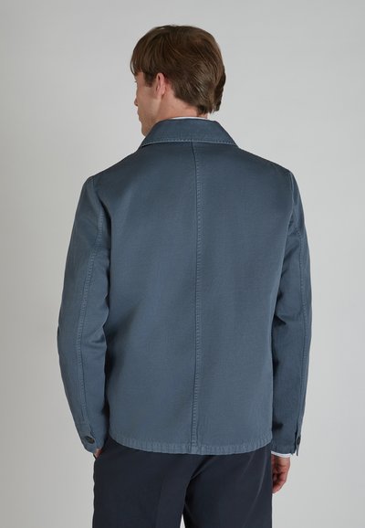 Men's blue jacket made from fabric with a smooth texture. Features a shirt collar and buttoned cuffs with a straight-cut design.