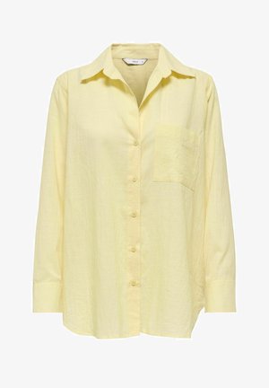 Cămașă galben deschis cu mâneci lungi, nasturi pe partea din față, cu guler și buzunar la pieptul stâng, prezentând un material ușor texturat.