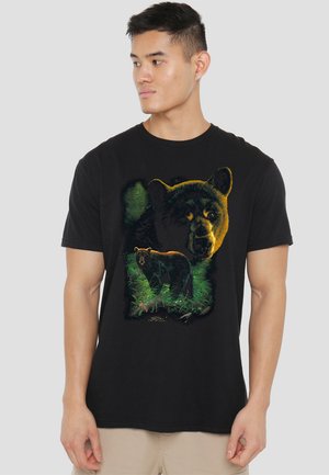 Black cotton t-shirt featuring a colorful bear graphic, detailed with green foliage and a second bear silhouette in the background.