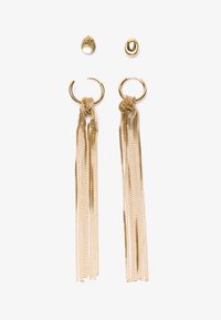 Gold earrings featuring a circular hoop with cascading chain tassels. Includes a pair of small oval stud earrings.