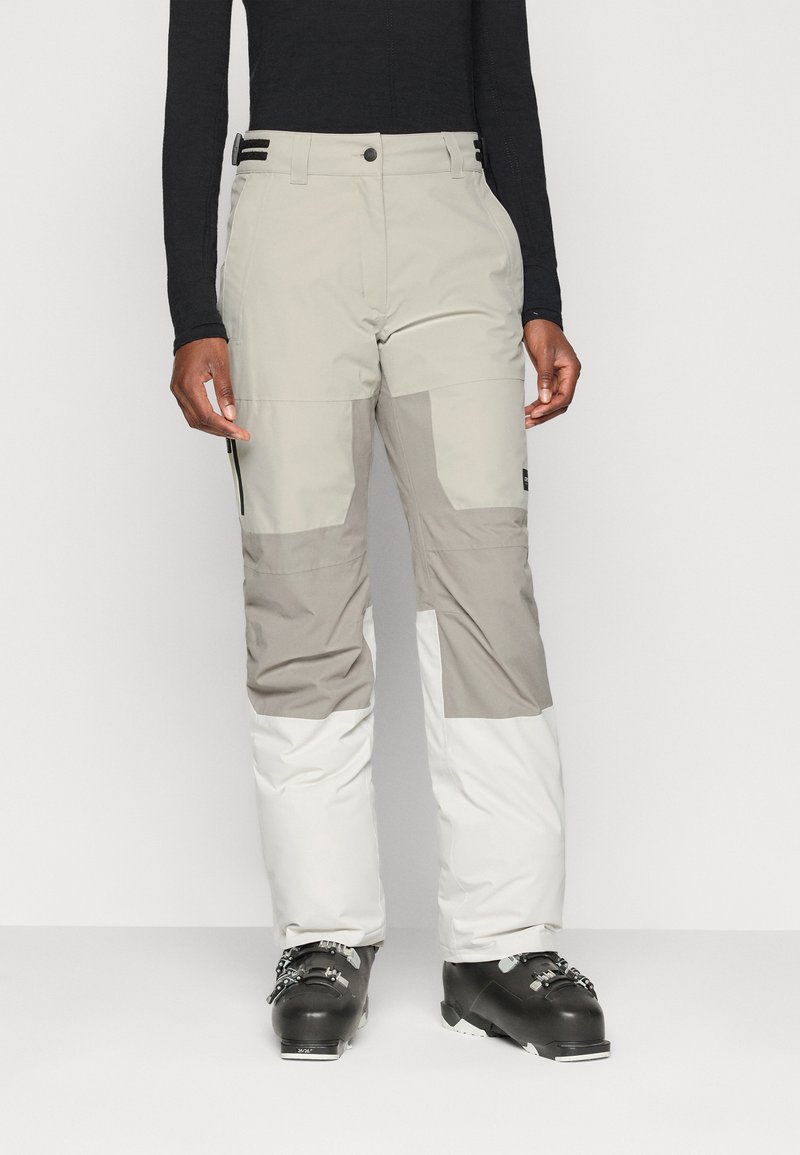 Ski pants in light gray, dark gray, and white; features zip pockets, a button closure, and reinforced cuffs. Made of water-resistant material.