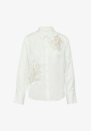 White button-up shirt with long sleeves, featuring gold and silver embroidered leaf patterns on the left side. Smooth fabric texture.