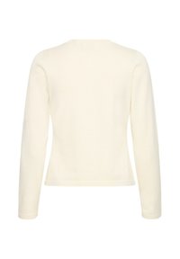 Pull couleur crème à manches longues avec un col rond, confectionné dans un tissu doux ; silhouette ajustée et ourlets ornés d'une texture côtelée subtile.