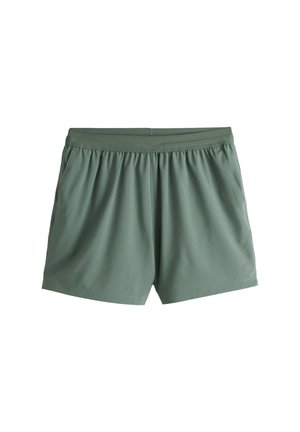 Grüne Sportshorts mit elastischem Bund und Seitentaschen, für Komfort und aktive Nutzung konzipiert.