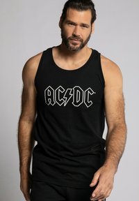 Zwarte katoenen tanktop met het "AC/DC"-logo in het wit, voorzien van een bliksemschichtontwerp. Eenvoudige, mouwloze snit met een ronde halslijn.