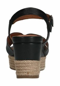 Zwarte leren wedge sandalen met een dikke, met jute gewikkelde hak, voorzien van een verstelbare enkelriem en een soepel binnenwerk.