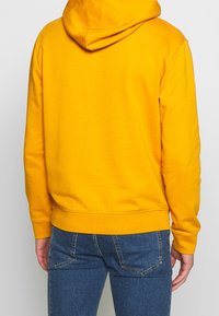 McQ Alexander McQueen Jersey con capucha - mustard yellow