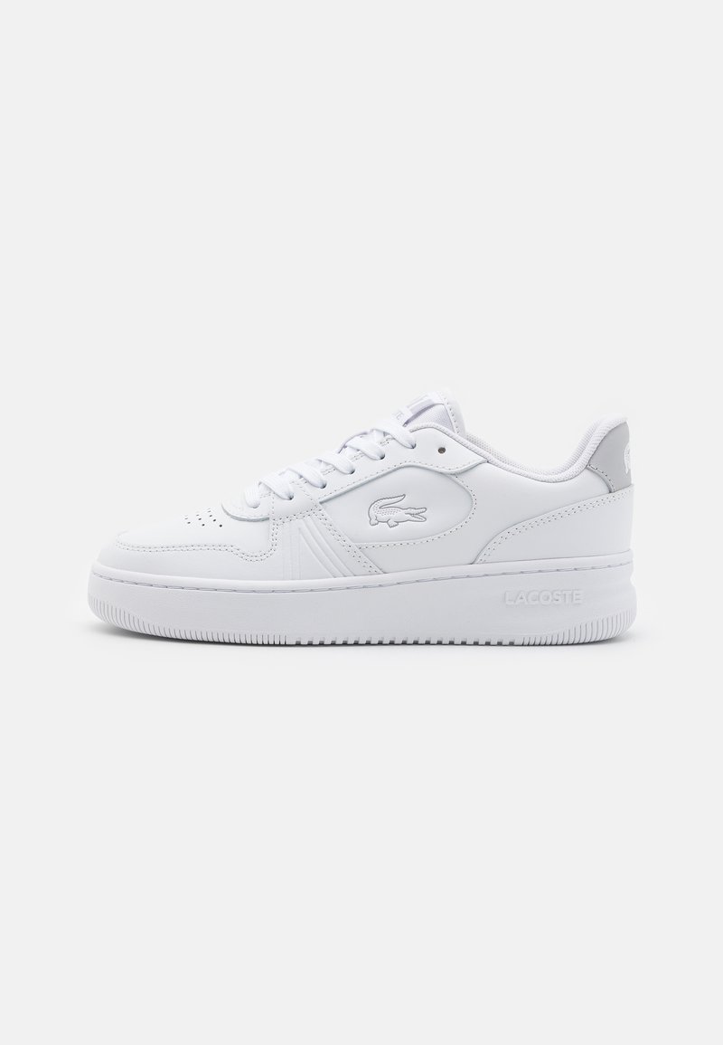 White athletic sneaker with smooth leather upper, round toe, and lace-up closure. Features embossed logo and grey accent on heel. Flat rubber sole.