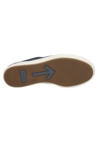 Rubber sole with a brown texture, featuring a white edge. Decorative gray arrow pattern and branding on the bottom.