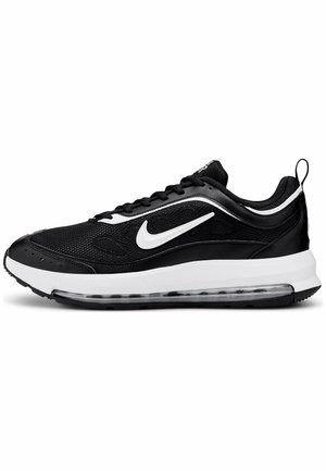 Czarno-biały sneaker Nike Air Max z siateczkową cholewką, widoczną podeszwą z poduszką powietrzną i białym logo Nike z boku.