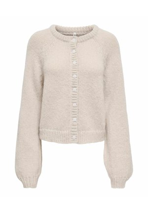 Krēmkrāsas adīta jaka ar apaļu kakla izgriezumu, gariem piedurknēm, ribotiem aprocēm un apakšmalu, kā arī aizmugurē ar septiņām baltām pogām aiztaisāma.