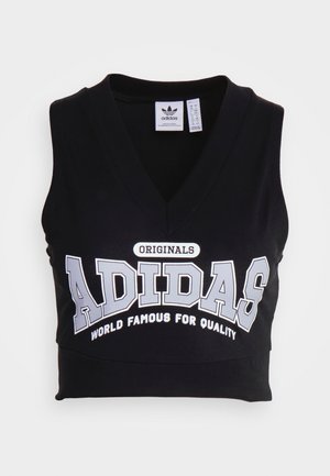 Black sleeveless crop top made of cotton, featuring a V-neck design and white print with "ADIDAS" and "WORLD FAMOUS FOR QUALITY" text.