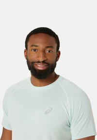ASICS SEAMLESS SS - Sports T-shirts - light celadon birch