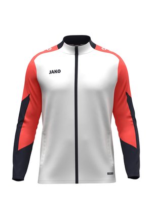 Biała sportowa kurtka na zamek z czerwonymi i czarnymi długimi rękawami, wysokim kołnierzem i logo "JAKO" na lewej piersi.