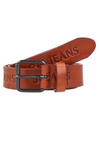 Pruun nahast vöö, millel on reljeefne „JEANS” tekst ja tume metallist pandla. Disain näitab siledat tekstuuri ja kitsenevat otsa.
