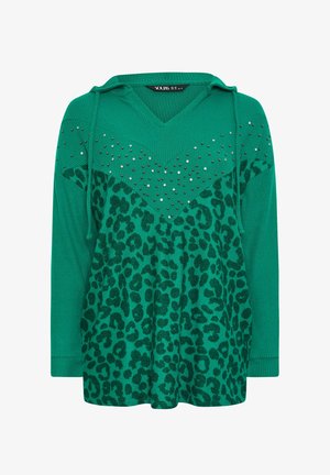 Grøn hoodie med ribbet tekstur, der har et leopardmønster nederst og er prydet med sølvnitter i den øverste sektion.