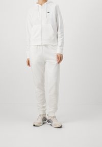 Lacoste Sport Teplákové kalhoty - off-white