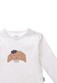 Weißer Langarm-Bodysuit mit einer braunen Croissant-Illustration, einem schwarzen Barett und dem Text "Bonjour mon amour" darunter.