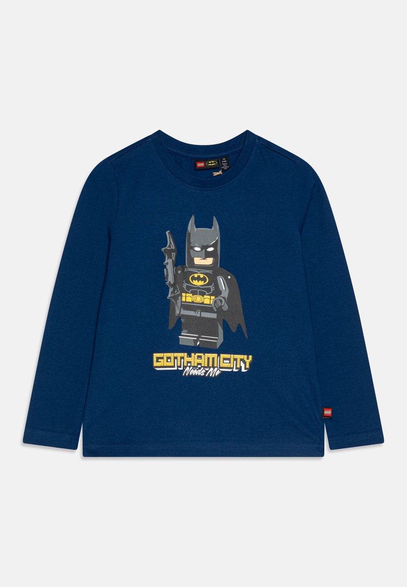 Långärmad t-shirt i marinblå färg i bomull, med en LEGO Batman grafik och en gul "Gotham City"-text nedanför. Mjuk textur med rund hals.