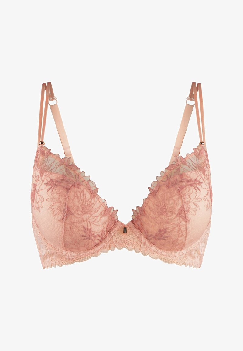 Soutien-gorge en dentelle rose avec broderie florale, doté de bretelles réglables, de bords festonnés et d'une embellissement central. Matériau doux et transparent.