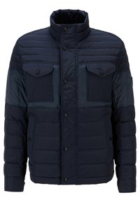 Námořnická péřová bunda s vysokým límcem, dvěma náprsními kapsami a patentkami. Vyrobena z hladké, prošívané látky s viditelným švem.