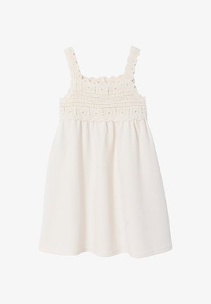 White sleeveless dress with crochet floral detailing on the bodice and straps, featuring a loose, flowing skirt.