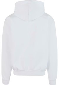 Hoodie blanc avec une texture douce, doté d'une capuche et de poignets et d'un ourlet côtelés. Design simple, sans graphiques ni motifs visibles.