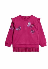 Felpa rosa con maniche arricciate, decorata con motivi di farfalla in paillettes. Il fondo ha un orlo a pieghe testurizzato.