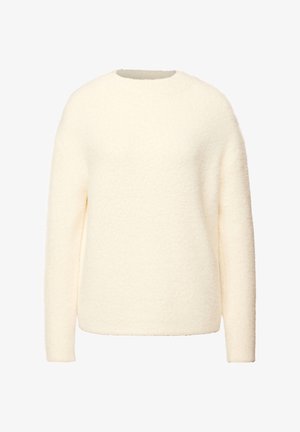 Krémový svetr s měkkou texturou, kulatým výstřihem a dlouhými rukávy; má volný, oversized střih bez viditelných zapínání.