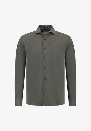 Tume rohelise kangaga pikkade varrakatega särk, millel on krae nööpidega, esine nööbid ja väike logo rinnal. Sile tekstuur.