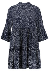 Granatowa sukienka z wysokim dekoltem, rozkloszowanymi rękawami, warstwowym krojem i białym wzorem w kropki na całej powierzchni. Wykonana z lekkiego materiału.