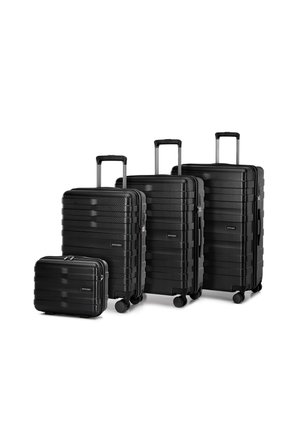 Four black hard-shell suitcases of varying sizes with a textured stripe design, extending handles, and wheels for easy mobility.