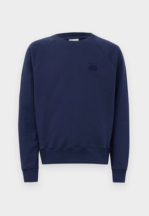 Marineblaue Rundhalsjacke mit langen Ärmeln und einem kleinen gestickten Logo auf der linken Brust.
