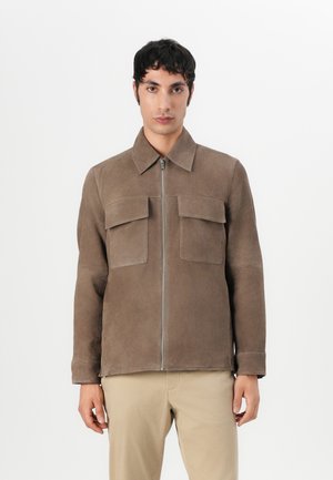 Brown suede jacket with a collar, front zipper, and two chest pockets. Features straight cut and smooth texture. Neutral background.