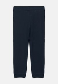 Navyblauwe katoenen leggings met elastische tailleband, taps toelopende pasvorm en ribbels aan de enkels. Vlotte textuur, minimalistisch ontwerp.
