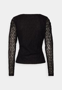 Black lace long-sleeve top featuring a textured pattern, fitted silhouette, and a round neckline, with sheer sleeves and solid bodice.