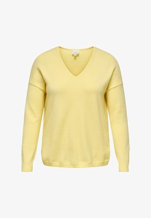 Suéter amarillo de cuello en V con mangas largas, hecho de tela suave. Presenta puños y borde inferior acanalados. Diseño sencillo sin patrones ni detalles.