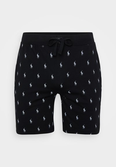 Black cotton shorts with white embroidered logo pattern, featuring an elastic waistband and drawstring closure. Flat front design.