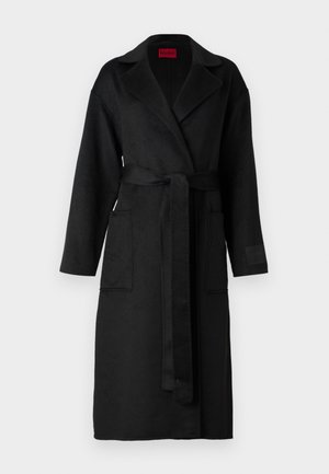 Black long coat with a belted waist, featuring a notched collar, two front pockets, and a textured fabric. No patterns or embellishments.