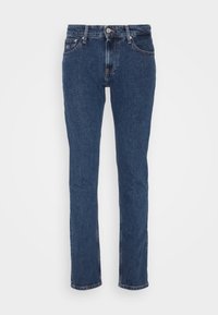 Mørkeblå denimjeans med rett ben, fem lommer, sølvfarget hardware og en subtil falmet tekstur. Klassisk mid-rise livlinje.