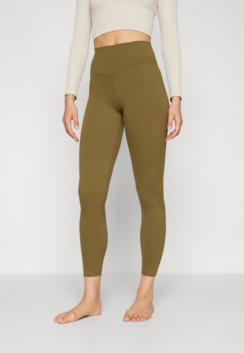 High-waisted olive green leggings made from soft, stretchy material with a smooth texture and clean stitching along the sides.